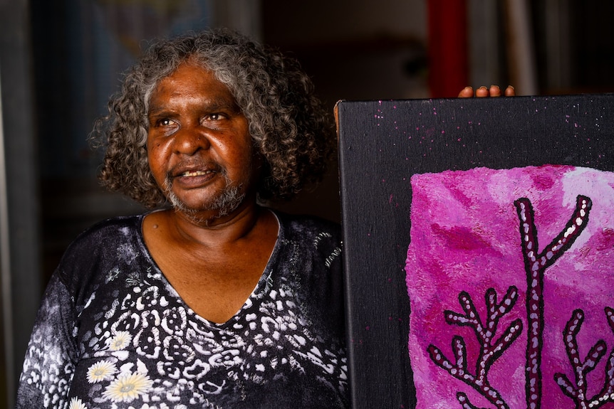 A close up of Betty with part of her purple painting. 