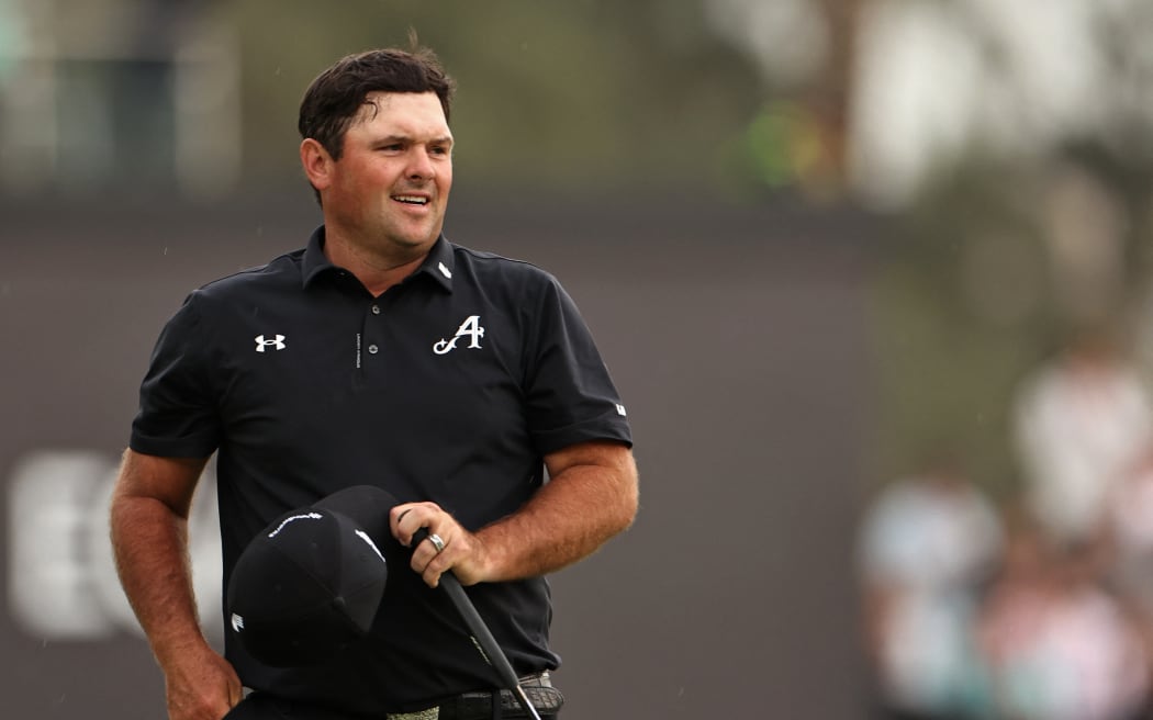 Patrick Reed of the US celebrates after winning the Hero Dubai Desert Classic golf tournament at the Emirates Golf Club in Dubai on January 25, 2026. (Photo by Fadel SENNA / AFP)