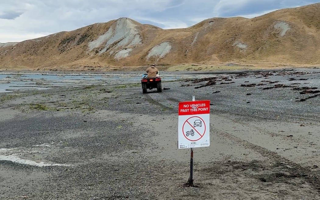 A quad-bike rider driving into the prohibited red zone