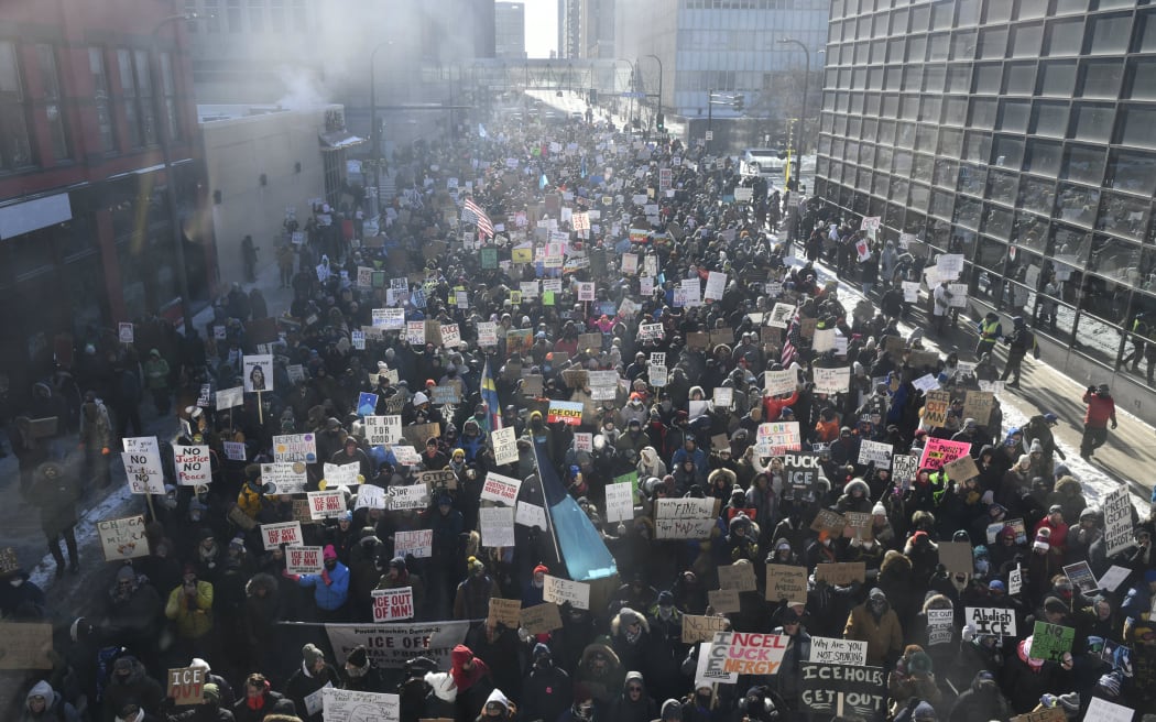 Protesters gather in downtown Minneapolis demanding Immigration and Customs Enforcement (ICE) leave Minnesota following the fatal shooting of 37-year-old ICU nurse Alex Pretti by ICE agents during a federal immigration enforcement operation, in Minneapolis, Minnesota, on January 25, 2026. On January 24, federal agents shot dead US citizen Alex Pretti, a 37-year-old ICU nurse, while scuffling with him on an icy roadway, less than three weeks after an immigration officer shot and killed Renee Good, also 37, in her car. His killing sparked new protests and impassioned demands by local leaders for the Trump administration to end its operation in the city. (Photo by Octavio JONES / AFP)