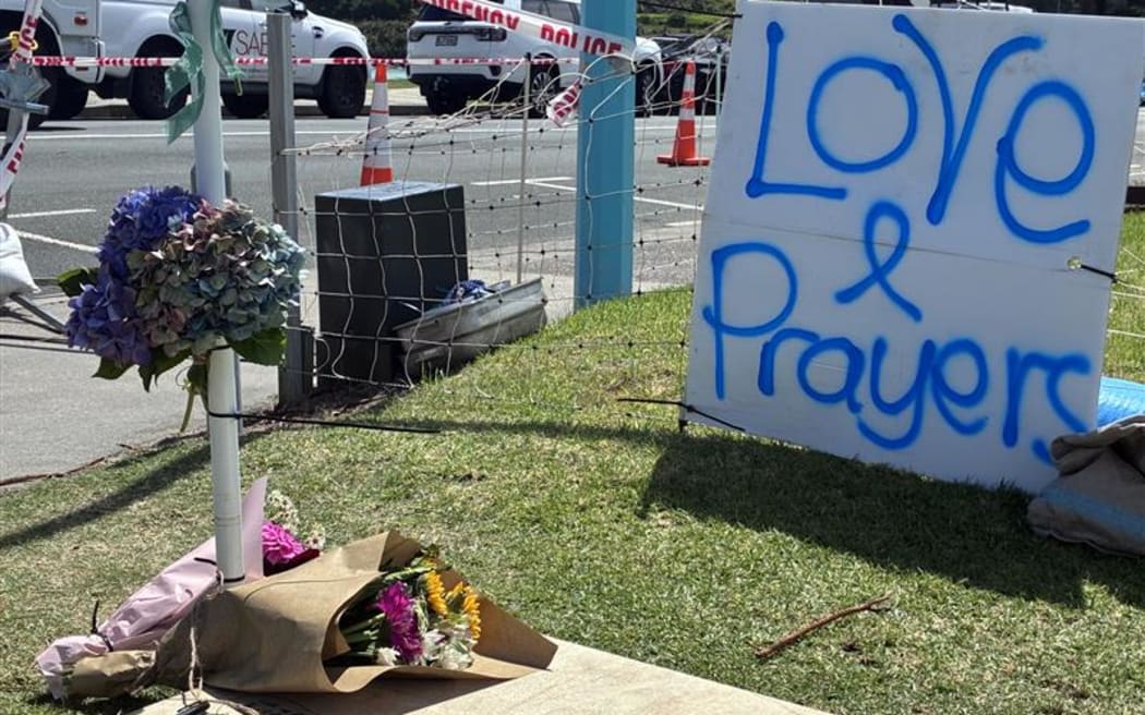 Tributes at the Mt Maunganui landslide cordon.