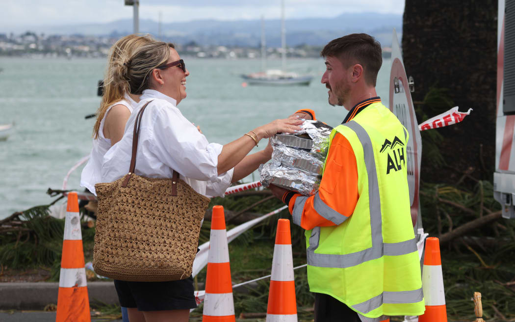 Mother and daughter (for Kim Baker-Wilson story) bakers pictured dropping off muffins at the scene at the landslide that crashed through the Beachside Holiday Park in Mt Maunganui, New Zealand, yesterday morning. Several people are still missing and believed to be buried in the slip.23 January 2026 Photograph by Alan Gibson.