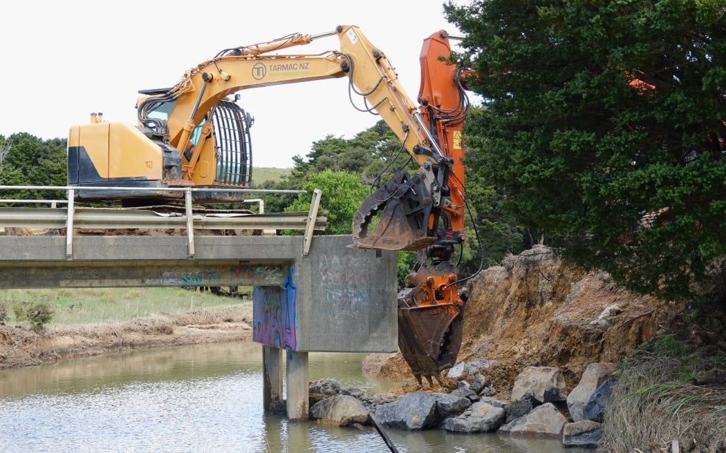 Work to reinstate a washed-out bridge at Ngaiotonga started on Friday, once diggers could reach the area.