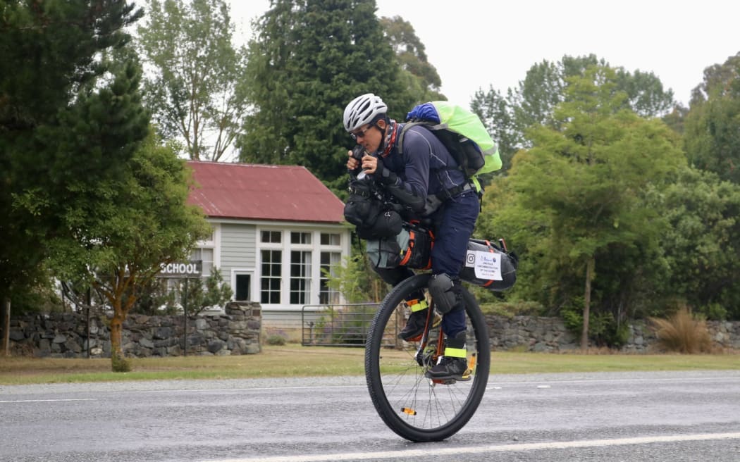 Norm Joe on his unicycle.