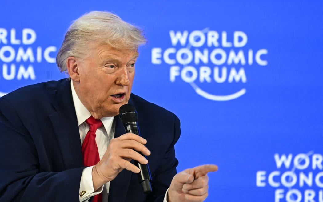 US President Donald Trump gestures as he speaks during the World Economic Forum (WEF) annual meeting in Davos on January 21, 2026. The World Economic Forum takes place in Davos from January 19 to January 23, 2026. (Photo by Fabrice COFFRINI / AFP)