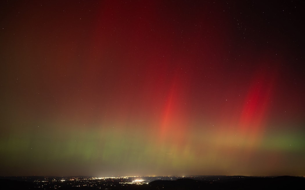 Aurora borealis, or northern lights, produced by a solar geomagnetic storm are seen from Shenandoah National Park in Rileyville, Virginia, in October 2024.