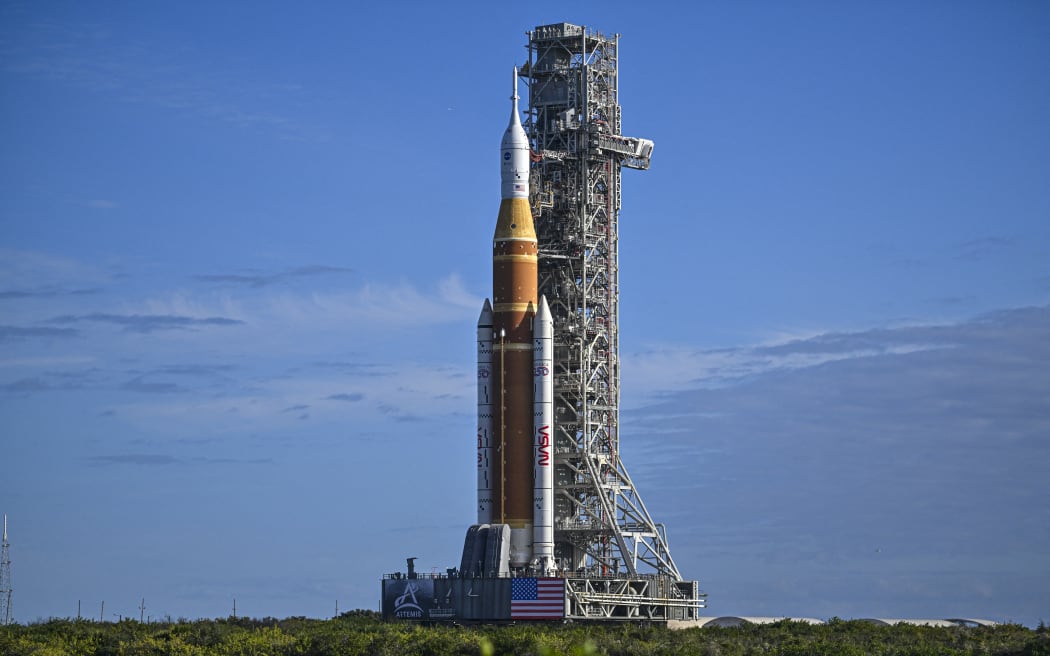 NASA's Artemis II Space Launch System rocket and Orion spacecraft are rolled out of the Vehicle Assembly Building to Launch Pad 39B at Kennedy Space Center in Florida on January 17, 2026, ahead of the crewed lunar mission. (Photo by Miguel J. Rodriguez Carrillo / AFP)