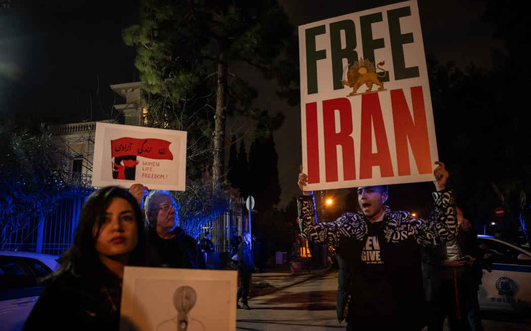 Iranian nationals living in Greece take part in a rally in support of the Iranian people in front of the Iranian Embassy in Athens on January 16, 2026. (Photo by Angelos TZORTZINIS / AFP)