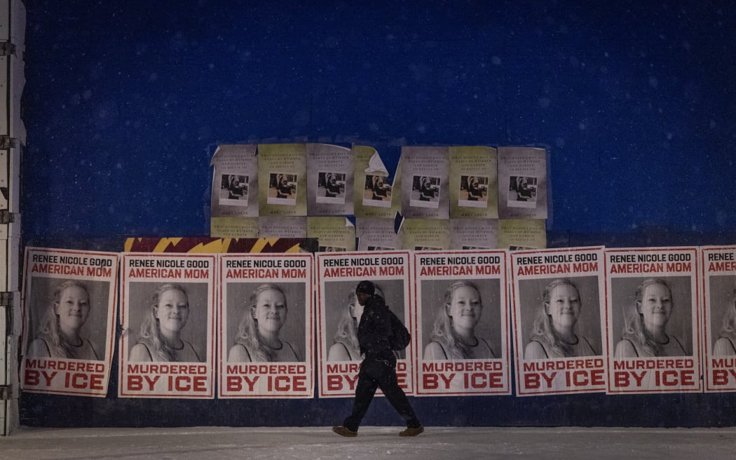 MINNEAPOLIS, MINNESOTA - JANUARY 16: A man walks by a series of posters memorializing Renee Good on January 16, 2026 in Minneapolis, Minnesota. Protests have sparked up around the city after a federal agent fatally shot Good in her car during an incident in south Minneapolis on January 7.   Scott Olson/Getty Images/AFP (Photo by SCOTT OLSON / GETTY IMAGES NORTH AMERICA / Getty Images via AFP)