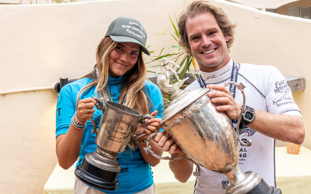 Maya Mateja (L) and Billy Stairmand celebrate their national championship surfing titles.