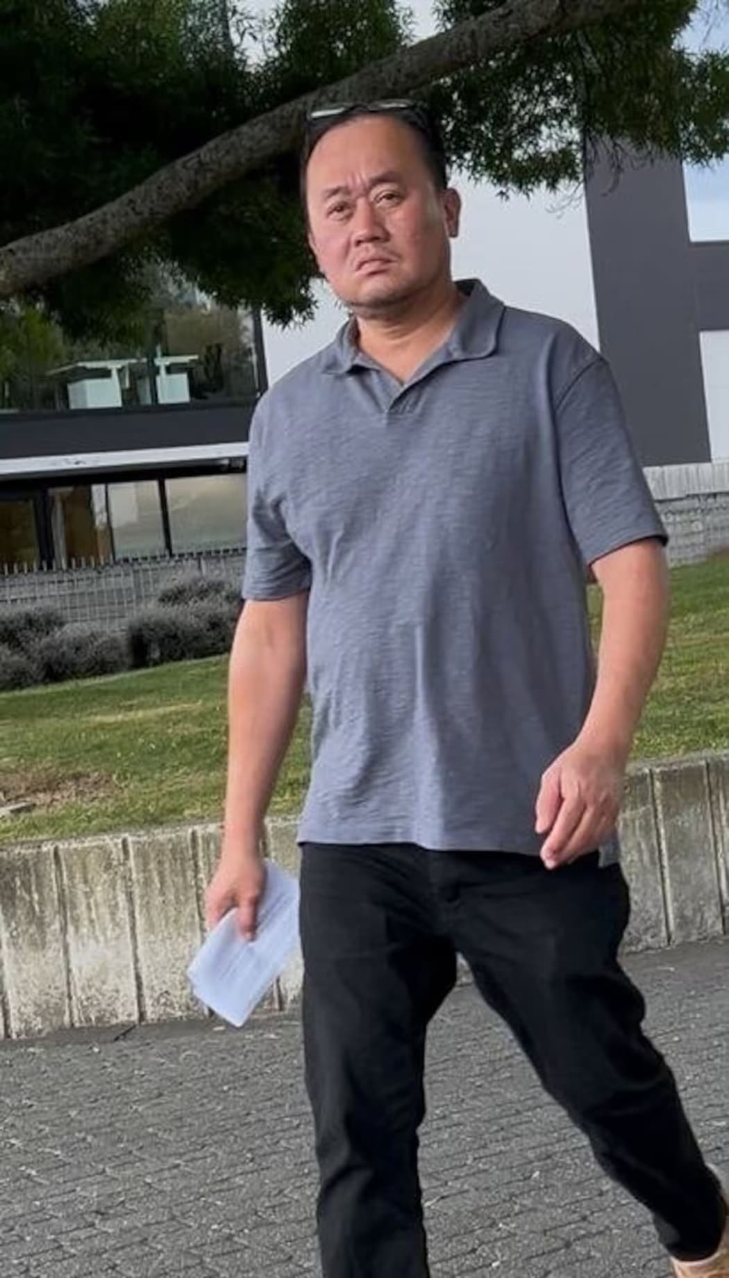 Richard Escutin leaves the Hamilton District Court after being sentenced on four representative charges of theft by a person in a special relationship totalling around $17,000 on Wednesday. Photo / Belinda Feek