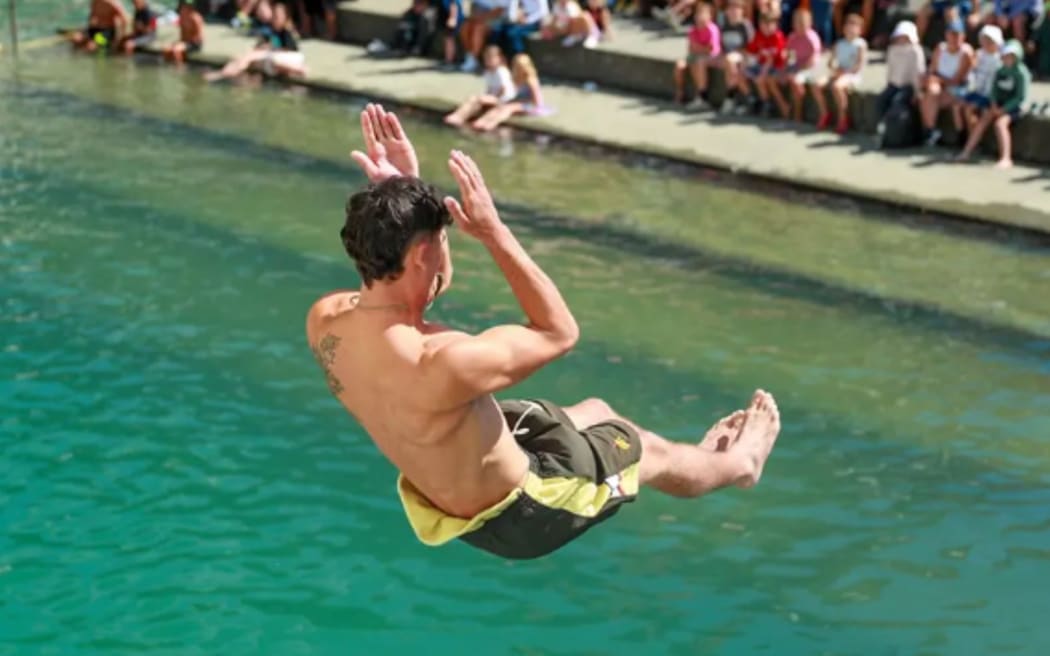 A competitor performs a manu during competition.