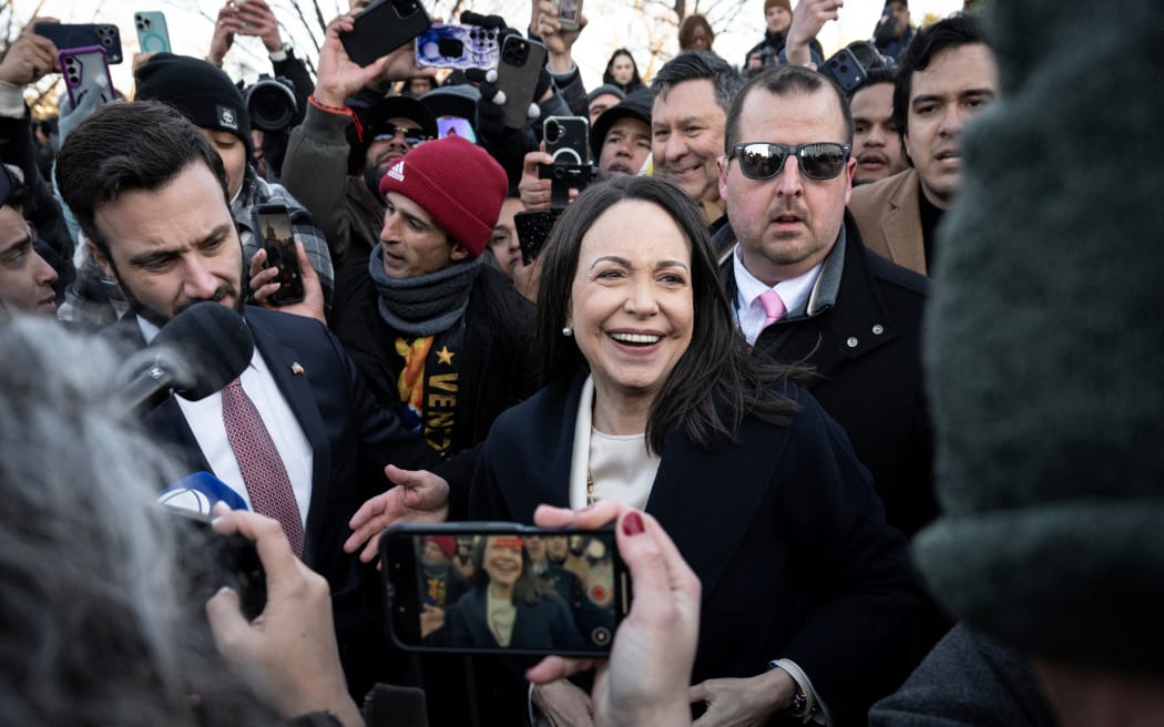 Venezuelan opposition leader Maria Corina Machado speaks to reporters as she departs the US Capitol after meeting with US senators on January 15, 2026 in Washington, DC. US President Donald Trump met earlier Thursday with Venezuelan opposition leader Machado, whose pro-democracy movement he has sidelined since toppling her country's leader, and whose Nobel Peace Prize he openly envies. (Photo by Drew ANGERER / AFP)