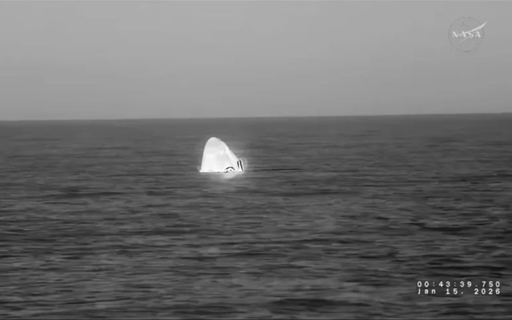 The SpaceX Dragon capsule is seen in the Pacific Ocean after splashdown off the coast of California.