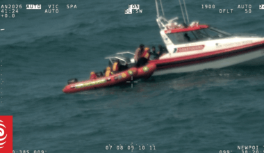 Men found clinging to life jacket, bucket and petrol can after boat capsizes