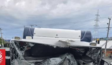 Auckland Transport bus crashes into power pole, damages building