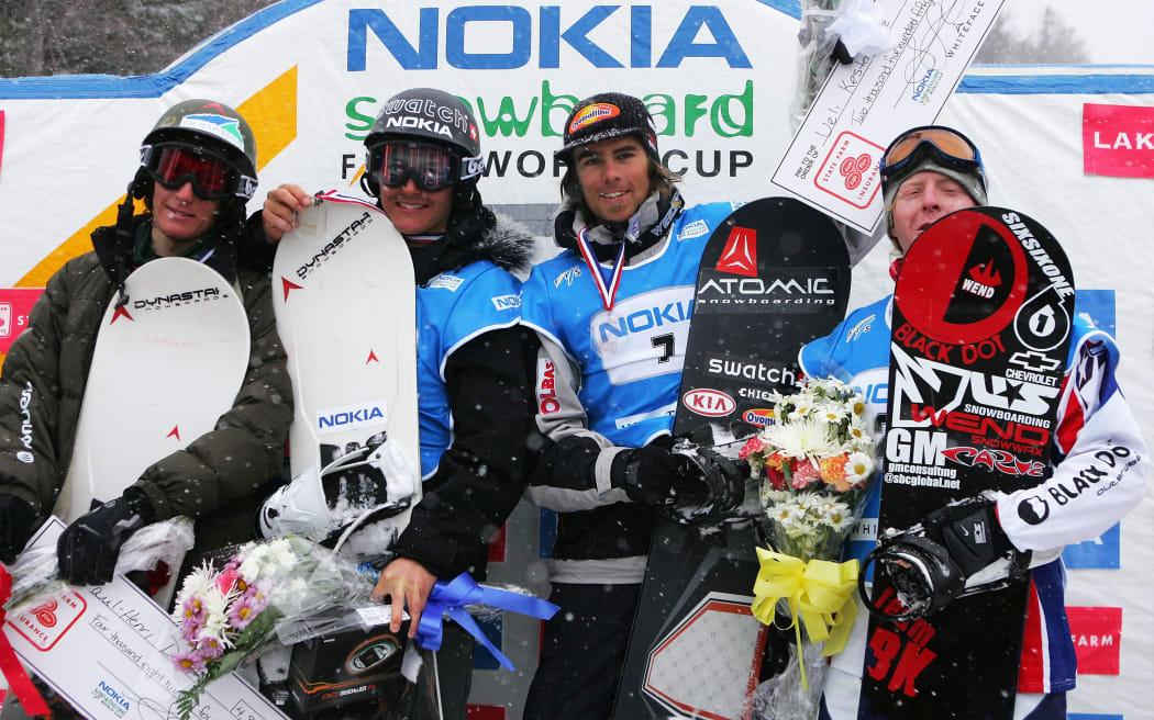 LAKE PLACID, NY - MARCH 6:  Paul-Henri Delerue of France (from left), his brother, Xavier Delerue of France, Ueli Kestenholz of Switzerland and Nate Holland of the USA stand on the podium after the Men's Snowboard Cross in the Nokia Snowboard FIS World Cup on March 6, 2005 at Whiteface Mountain in Lake Placid, New York. Delerue placed second behind his brother, Xavier Delerue, who came in first. Kestenholz placed third and Holland placed fourth.  (Photo by Ezra Shaw/Getty Images) *** Local Caption *** Paul-Henri Delerue;Xavier Delerue;Ueli Kestenholz;Nate Holland (Photo by Ezra Shaw / Getty Images North America / Getty Images via AFP)