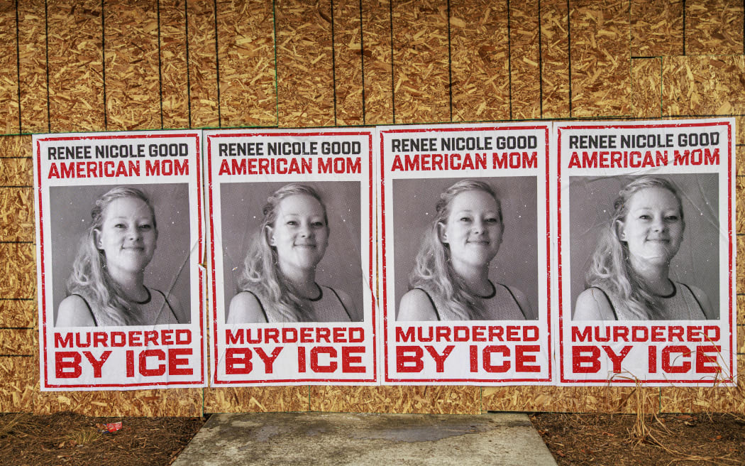Businesses boarded up in parts of Minneapolis display posters of Renee Nicole Good on plywood-covered windows following her fatal shooting by an ICE agent, in Minneapolis, Minnesota, on January 11, 2026. A US Immigration and Customs Enforcement (ICE) agent shot and killed 37-year-old Renee Nicole Good on the streets of Minneapolis on January 7, leading to huge protests and outrage from local leaders who rejected White House claims she was a domestic terrorist. (Photo by Kerem YUCEL / AFP)