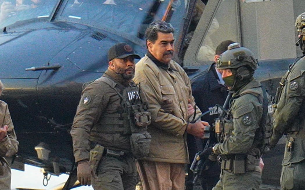 NEW YORK, NY - JANUARY 5: Nicolas Maduro is seen in handcuffs after landing at a Manhattan helipad, escorted by heavily armed Federal agents as they make their way into an armored car en route to a Federal courthouse in Manhattan on January 5, 2026 in New York City.  (Photo by XNY/Star Max/GC Images)