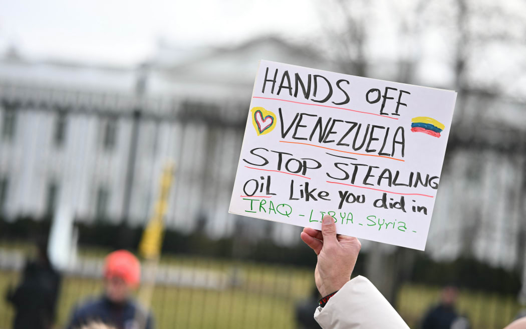 Protestors take part in a demonstration against US military action in Venezuela in Lafayette Square in front of the White House in Washington, DC, on January 3, 2026.