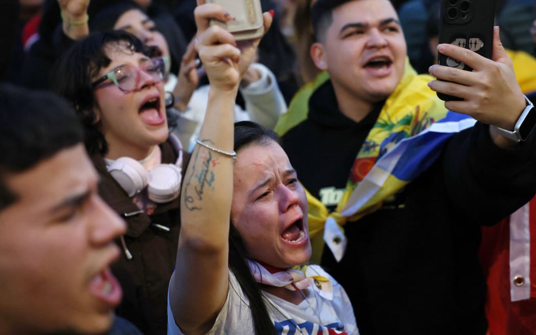 Venezuelan citizens living in Spain gather at Puerta del Sol square in Madrid on January 3, 2026, after US forces captured Venezuelan leader Nicolas Maduro after launching a 