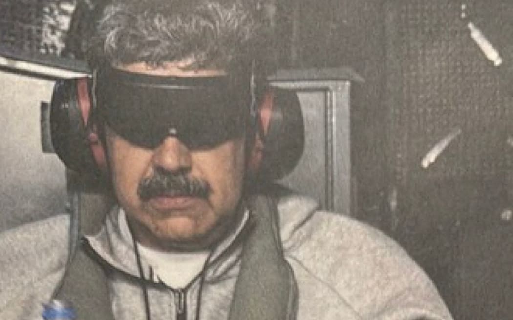 This image posted on US President Donald Trump's Truth Social account on January 3, 2026, shows what President Trump says is Venezuela's President Nicolas Maduro onboard the USS Iwo Jima after the US military captured him on January 3, 2026.