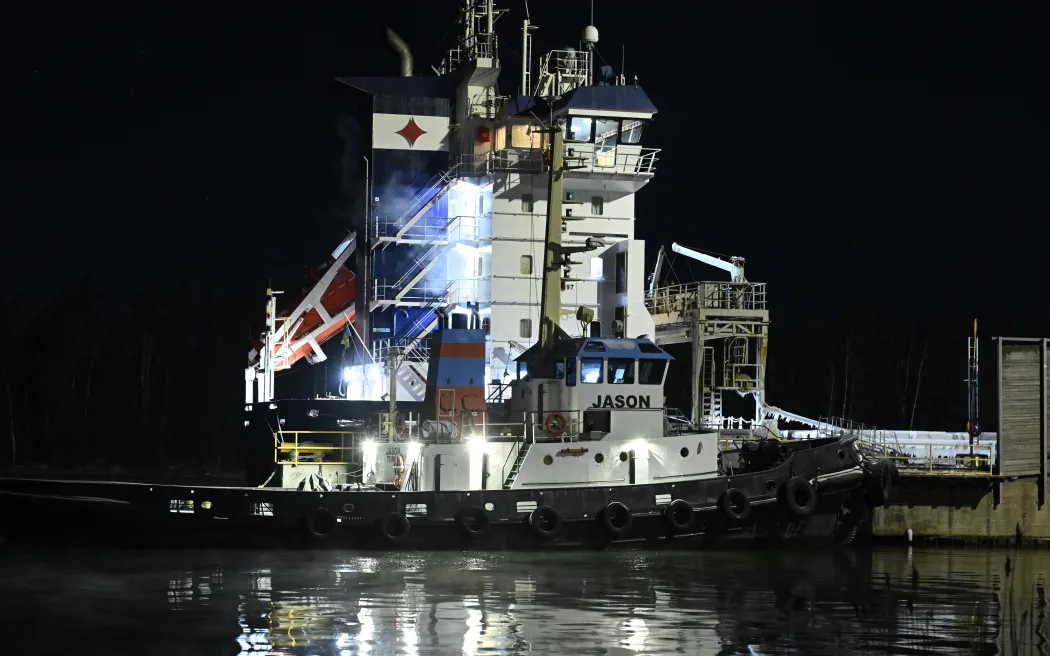 The Fitburg, a 132-meter-long cargo ship, is anchored in the harbour after being seized by Finnish authorities in Kirkkonummi on December 31, 2025. Finnish police said on December 31, 2025, they had seized a vessel suspected of damaging a telecommunications cable that runs between Helsinki and Tallinn in the Gulf of Finland several hours earlier. (Photo by Roni Rekomaa / Lehtikuva / AFP) / Finland OUT / FINLAND OUT / FINLAND OUT