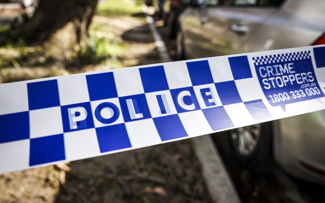 New South Wales (NSW) police tape can be seen across a road near the Russian consulate in Sydney on September 1, 2025. New South Wales Police said they were called to the Russian consulate after reports that an unauthorised vehicle was parked in the driveway. Officers attempted to speak to the driver, who then allegedly