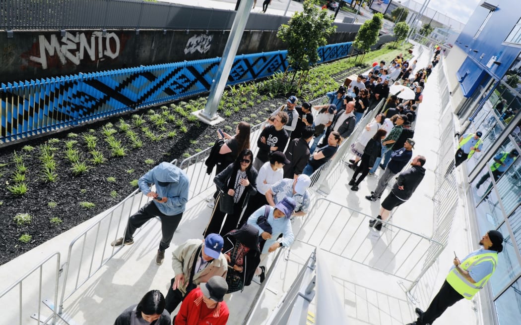 People queue to enter IKEA on its opening day in Auckland
