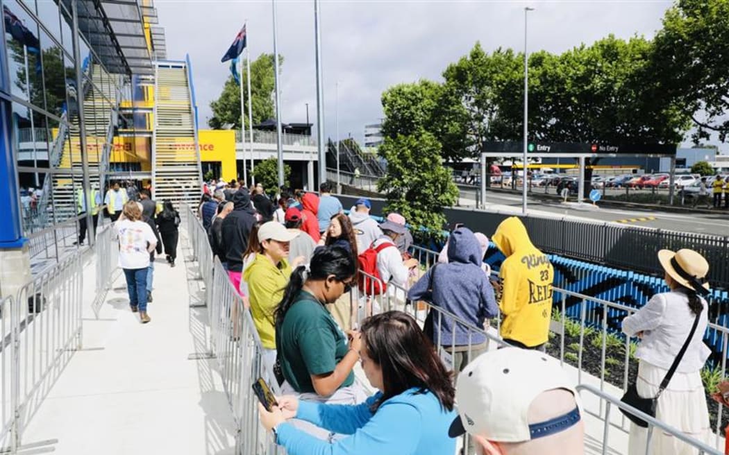 People queue to enter IKEA on its opening day in Auckland