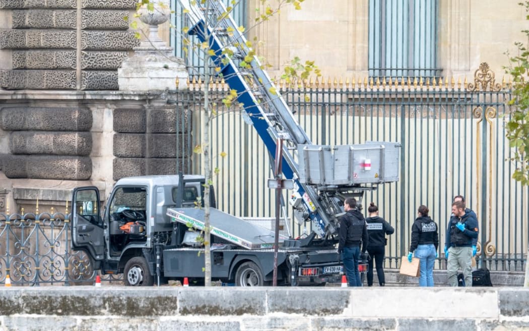 French forensic police are collecting evidence at the crime scene. The burglars electric saw is still on the front seat of the truck used by the burglars at the Louvre Museum, in Paris on Sunday, October 19, 2025, on Quai Francois Mitterrand. Burglars made a spectacular entrance during the museums opening with a truck equipped with a ladder into the Apollo Gallery to steal several priceless jewels, according to initial statements from the French Minister of Culture.