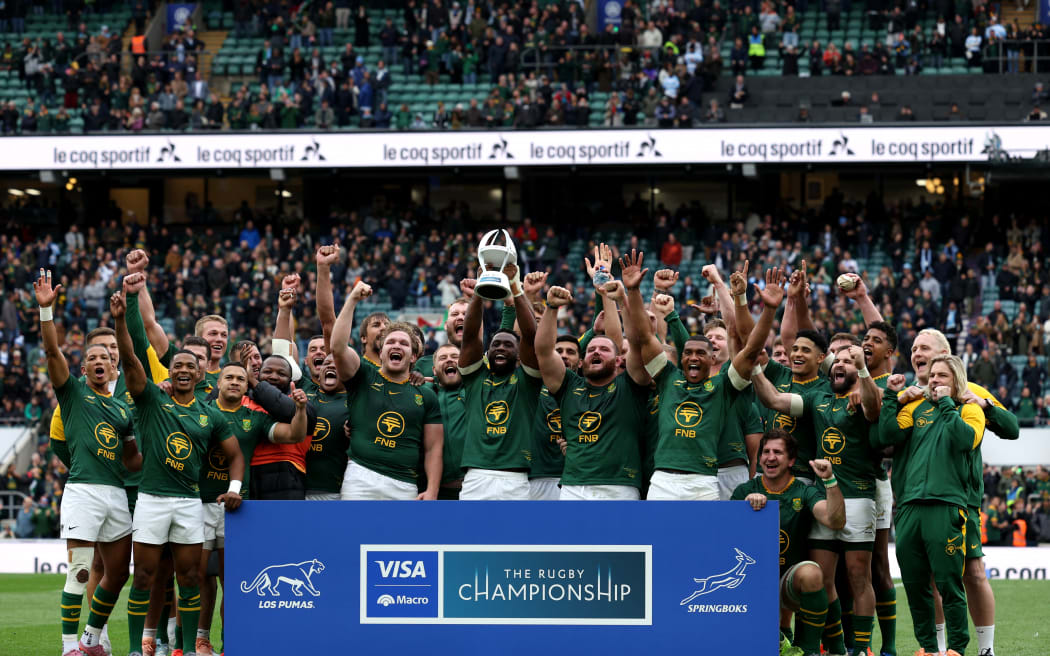South Africa's flanker Siya Kolisi lifts the winners trophy following the Rugby Championship Test match between Argentina and South Africa at The Allianz Stadium, Twickenham, south-west London on October 4, 2025. South Africa win the Rugby Championship (Photo by Adrian Dennis / AFP)