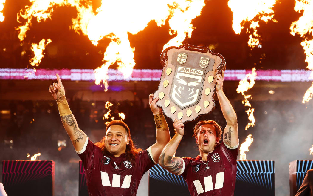 Maroons captain Cameron Munster and Josh Papalii of the Maroons (L) hold up the shield after victory in the State of Origin game three match between the Queensland Maroons and the New South Wales Blues at Accor Stadium in Sydney, Wednesday, July 9, 2025. (AAP Image/Mark Evans/ Photosport)