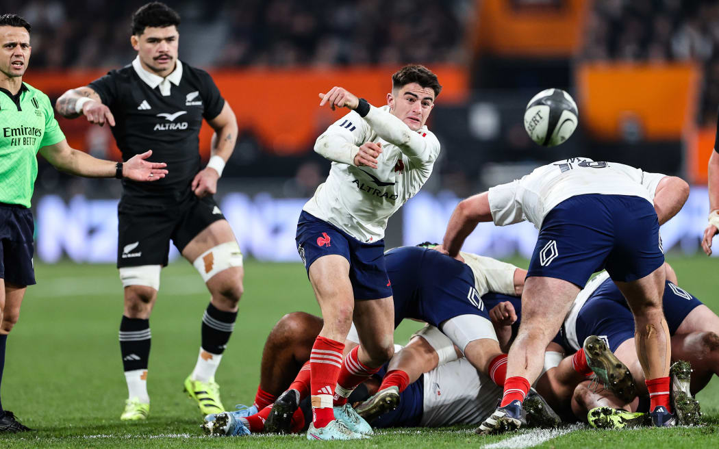 Nolann Le Garrec of France clears the ball against the All Blacks.