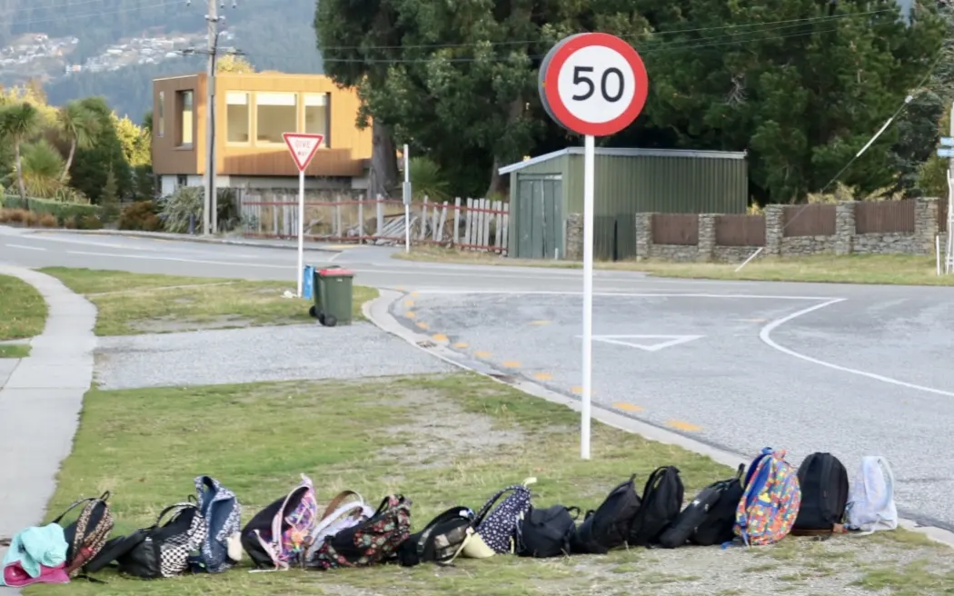 School bags lined up at a Kelvin Heights bus stop in Queenstown.
