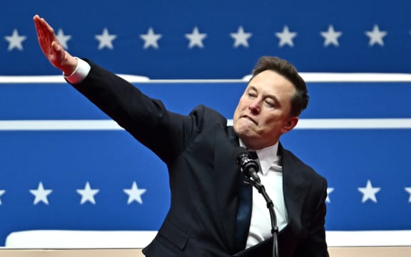 Tesla and SpaceX CEO Elon Musk gestures as he speaks during the inaugural parade inside Capitol One Arena, in Washington, DC, on January 20, 2025. (Photo by ANGELA WEISS / AFP)