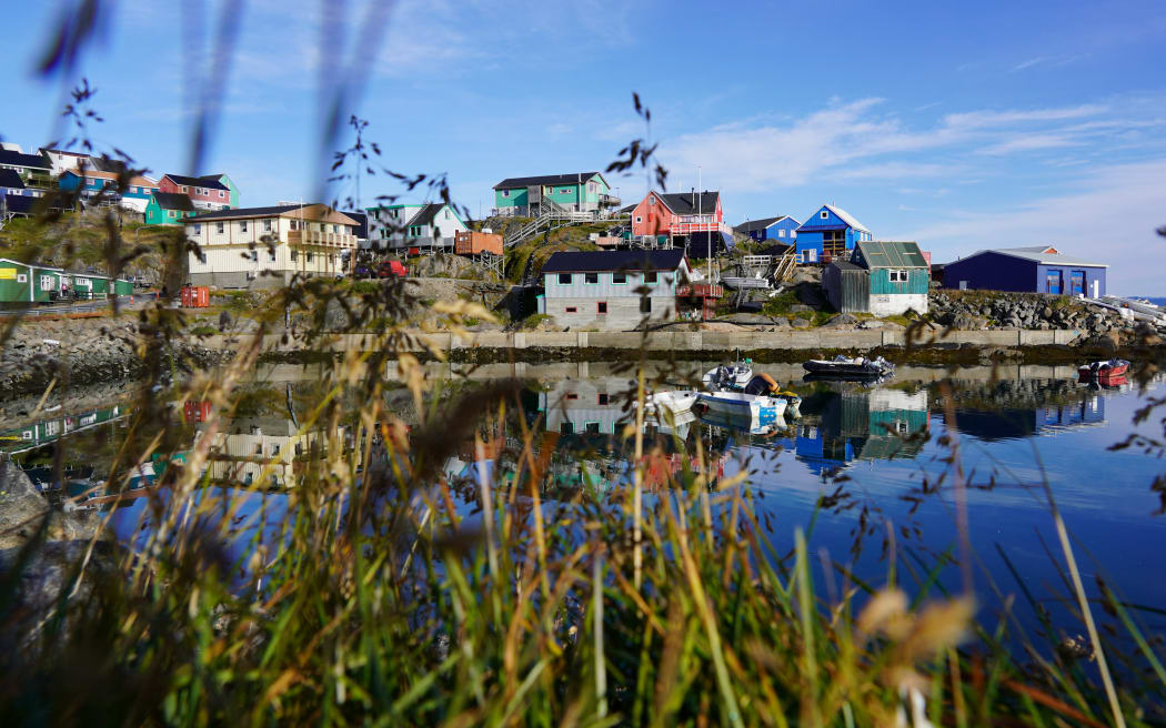 The Old Colonial Harbour of Nuuk, Greenland is pictured on August 31, 2024. - Greenland, an icy land whose rugged landscapes are bewitching, wants to attract more tourists, a paradox for a territory that is particularly vulnerable to global warming and whose geographical isolation means that many people have to take planes to get there. (Photo by James BROOKS / AFP) / TO GO WITH AFP STORY