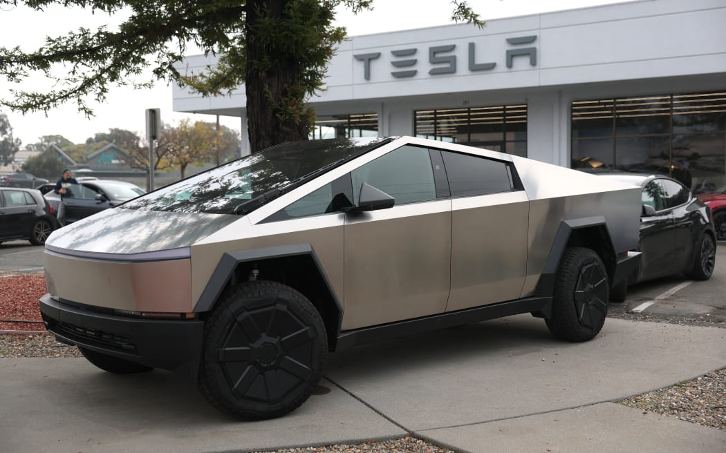 A Tesla Cybertruck is displayed at a Tesla dealership on December 20, 2024 in Corte Madera, California.