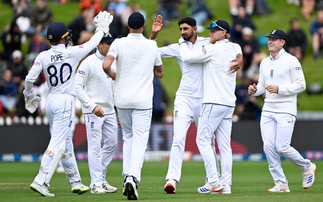 England bowler Shoaib Bashir celebrates the wicket of New Zealand's Glenn Phillips during play on the third day of the second cricket test between New Zealand and England at the Basin Reserve, Wellington. December 8, 2024.