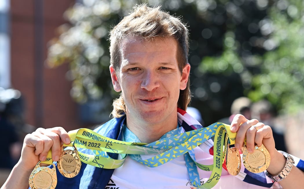 New Zealand cyclist Aaron Gate with his four gold medals from the 2022 Commonwealth Games.