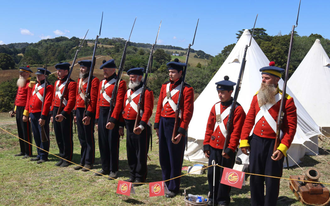 Members of the New Zealand Wars Re-enactment Society, in British uniforms of the 1840s, during the 2021 commemorations.