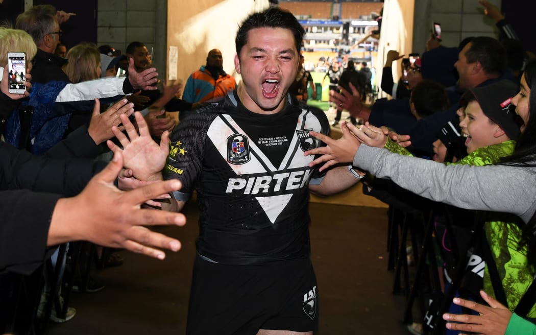 Brandon Smith celebrates with Kiwis fans after the team's win over Australia at Mt Smart Stadium.