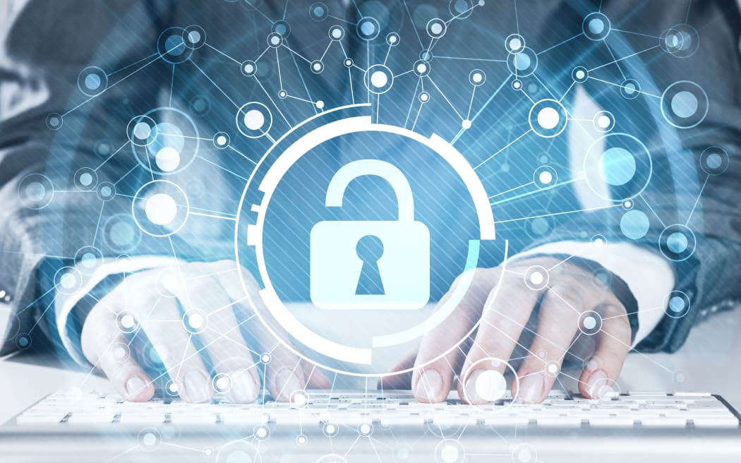 Close up of female hands using computer keyboard and lock icon on screen