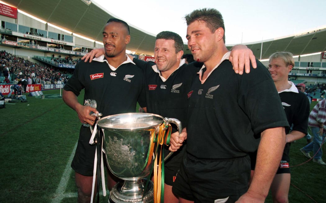 (L to R) Jonah Lomu, Sean Fitzpatrick and Craig Dowd celebrate with the Bledisloe Cup. New Zealand All Blacks v Australia. Bledisloe Cup, international rugby union test match. Sydney Football Stadium, Sydney, Australia. Saturday, 29 July 1995. © Copyright Photo: Andrew Cornaga / www.photosport.nz