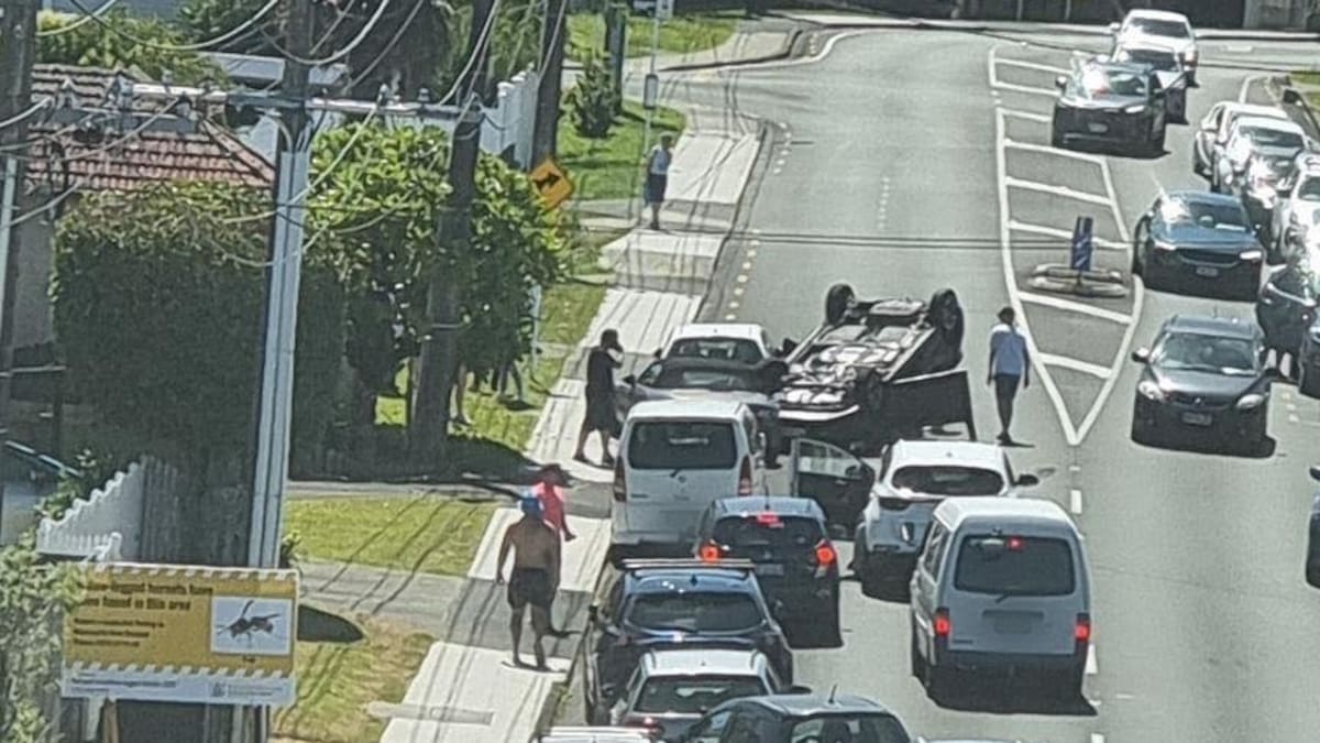 Auckland crashes: Car flips in Birkenhead as power pole brought down in Brown’s Bay accident