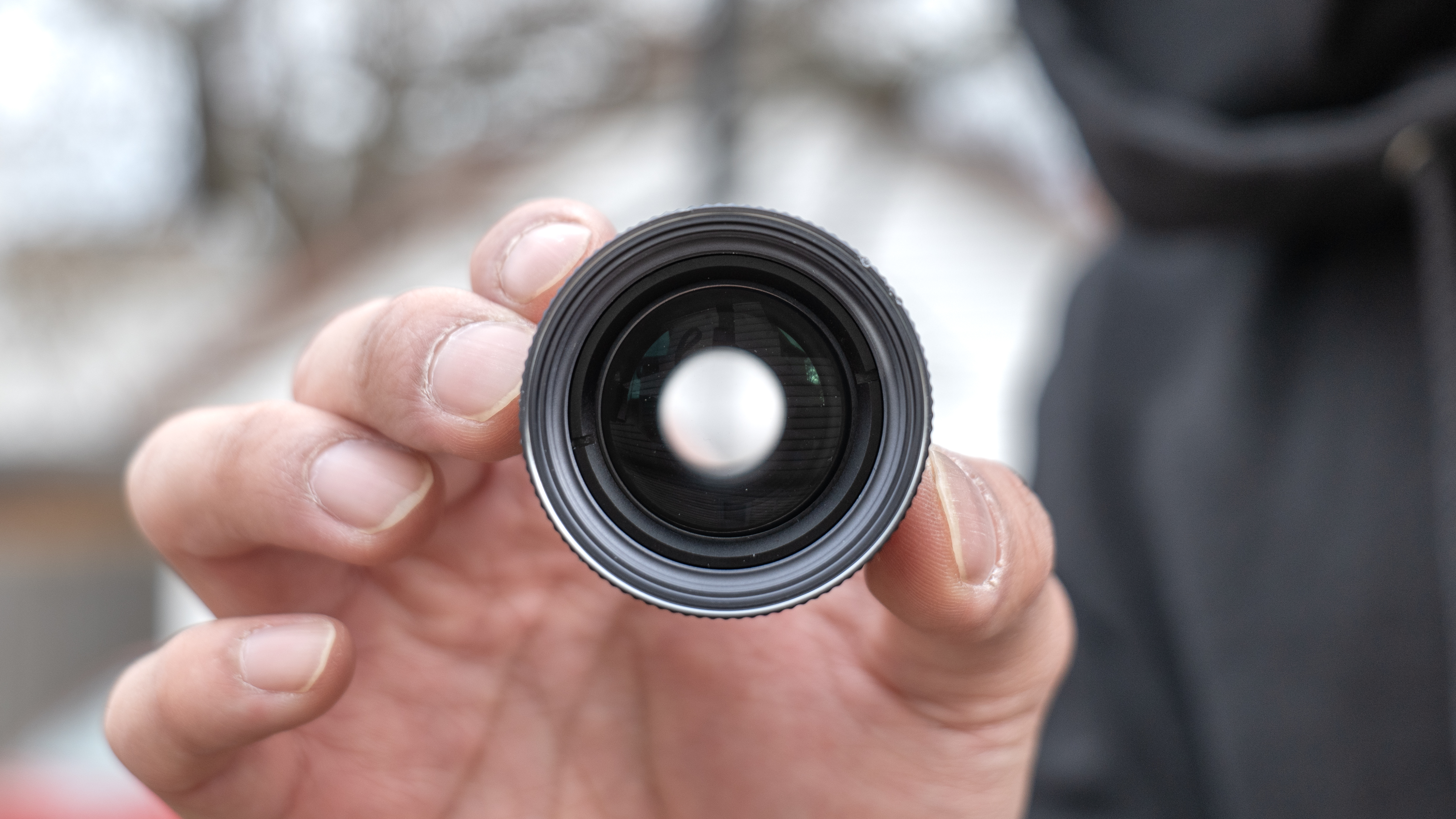 Shiftcam 240mm Super Zoom Tele Lens held in the hand.