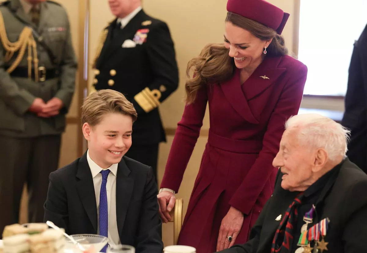 Prince George with mum Kate at a tea party for veterans at Buckingham Palace hosted by the Royal British Legion