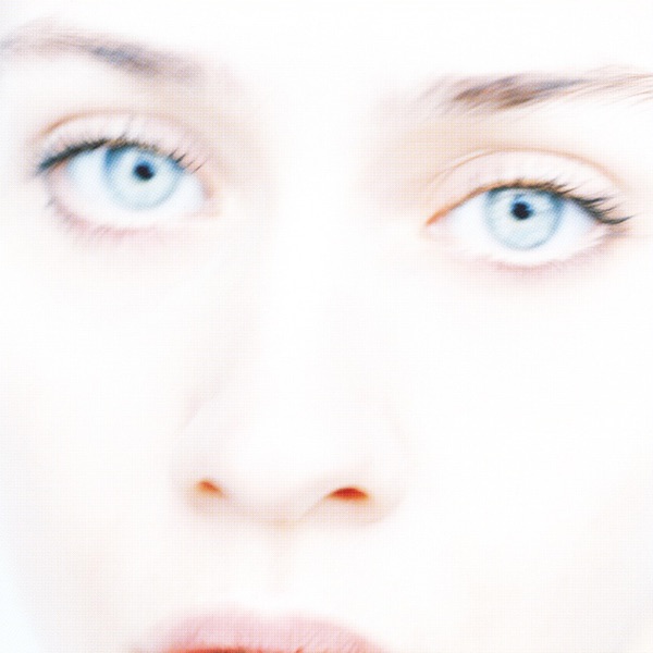 A close, cropped portrait of artist Fiona Apple's face, showing eyes, nose and top lip