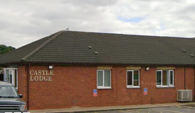 The exterior of Castle Lodge Independent Hospital in Bransholme. It is a long, single-storey building with windows. A car park is in front of it.