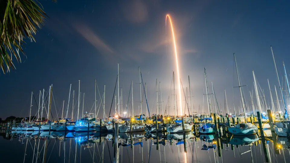 Timelapse photo of a rocket taking off at night